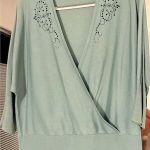 Mint Green Draped V-Neck Top with Embellished Shoulders and black slacks